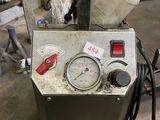 an image of a machine that is sitting in a garage