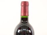 a bottle of wine that is sitting on a table