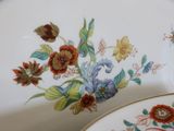 a plate with a flower design on it and a plate with a flower design on it