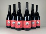 six bottles of red wine are lined up in a row