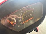 a close up of a speedometer on a motorcycle
