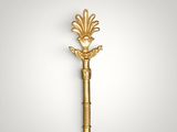 a gold key with a decorative design on it