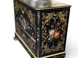 an image of a black and gold chest of drawers