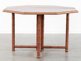 an octagonal bamboo table with a white top and a brown top