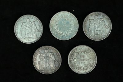 four silver coins with the image of jesus and other religious figures on them