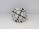 a white plate with a blue and white design on it