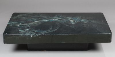 a close up of a black marble table on a white background