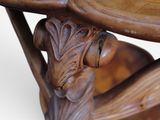 a close up of a wooden table with a clock on it