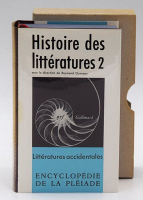 the book is in a cardboard box on a white surface