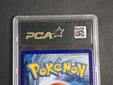 the pokemon game is in a plastic case on a table