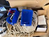 a box full of electrical wires and wires on the floor