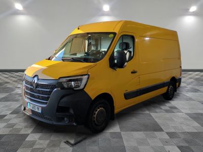 the yellow van is parked on a checkered floor in the garage