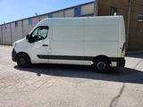 a white van that is parked in a parking lot