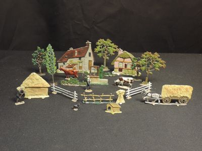 several figurines of a farm with a horse and a wagon