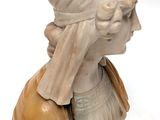 marble bust of a woman with a turban on her head