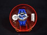 a blue and red watch sitting in a red box
