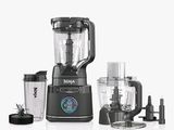 a blender that is sitting next to a blender and a blender