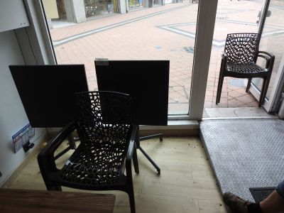 a person sitting in a chair in front of a window