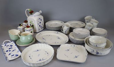 many different types of dishes and cups on the table