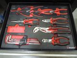 many different types of pliers in a tool box