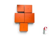 four orange boxes stacked on top of each other on a white surface