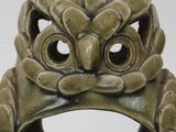 an image of a ring with a face on it