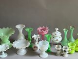 many different colored vases and bowls on the table