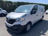 the white van is parked in a parking lot with other cars