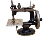 a black and silver sewing machine on a white background