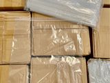 a pile of boxes that have been wrapped in plastic