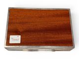a small wooden box with a sticker on it