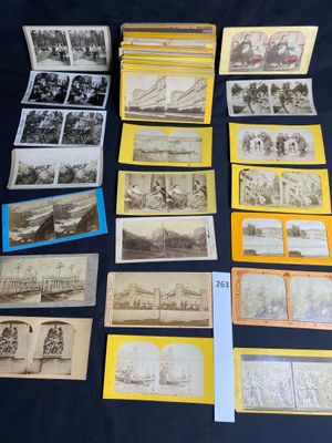 several old postcards of different types and sizes are on a table