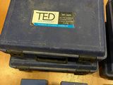 a plastic case with a blue label on it on a wooden table