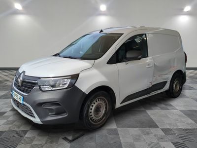 the white van is parked on a checkered floor in a room