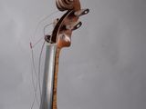 a violin that is sitting on top of a stand