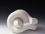 a white sculpture that is sitting on a table