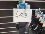 many pairs of gloves hanging on a rack in a store