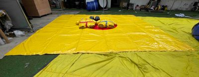 a yellow tarp that has a pair of shoes on it
