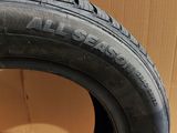 a close up of a tire on a cardboard box with a cardboard box in the background