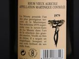 bottle of wine with label on a dark background with a black background
