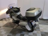 a motorcycle that is parked in a room with a checkered floor