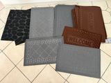 several mats are laid out on a tiled floor in a room