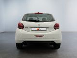 the rear end of a white car in a white room