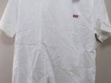 a white t - shirt with a red box logo on the chest