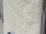 a mattress that is sitting on the floor in a store