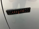 a close up of a sticker on the door of a car with the word vauto written on it