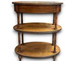an image of a three tiered wooden table with marble top