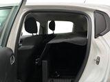 a white car with the door open and the passenger seat down