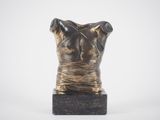sculpture of a female torso on a marble base