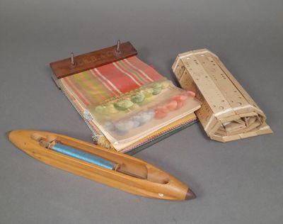 a book, a pencil, and a boat on a table